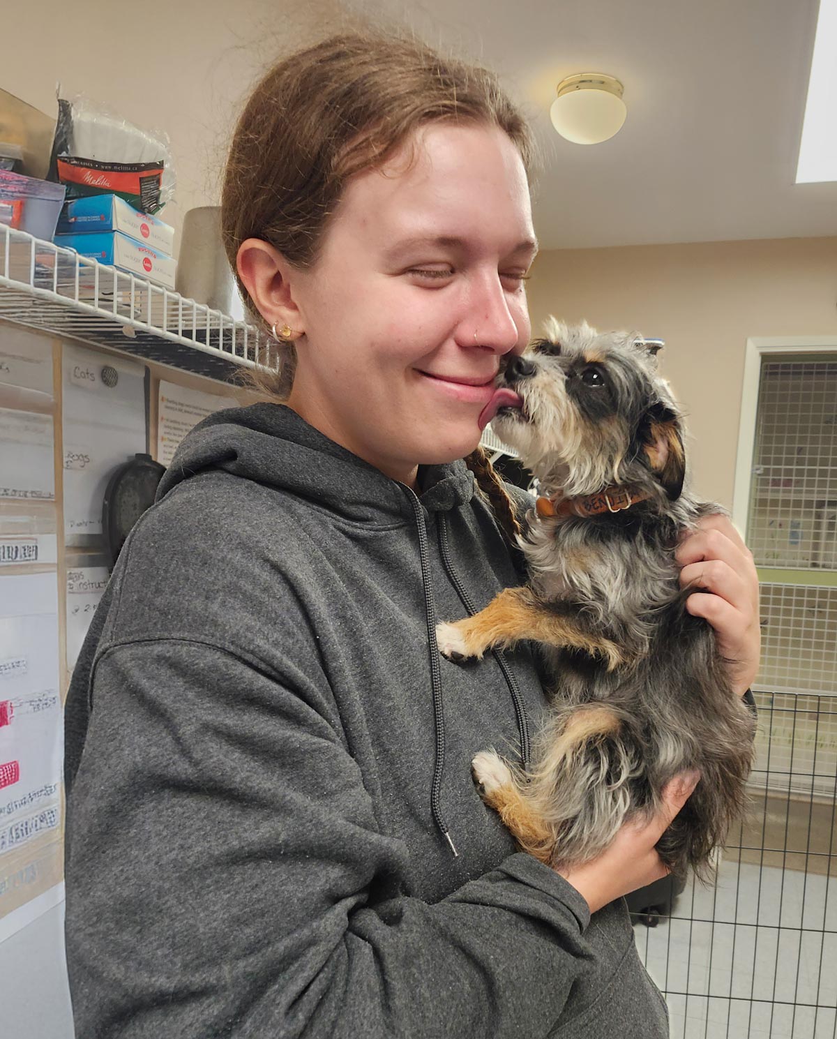 staff-with-yorkie staff member loving on dog